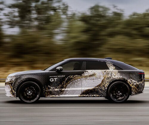 topographic camouflage traces the low-slung form of range rover's new electric GT